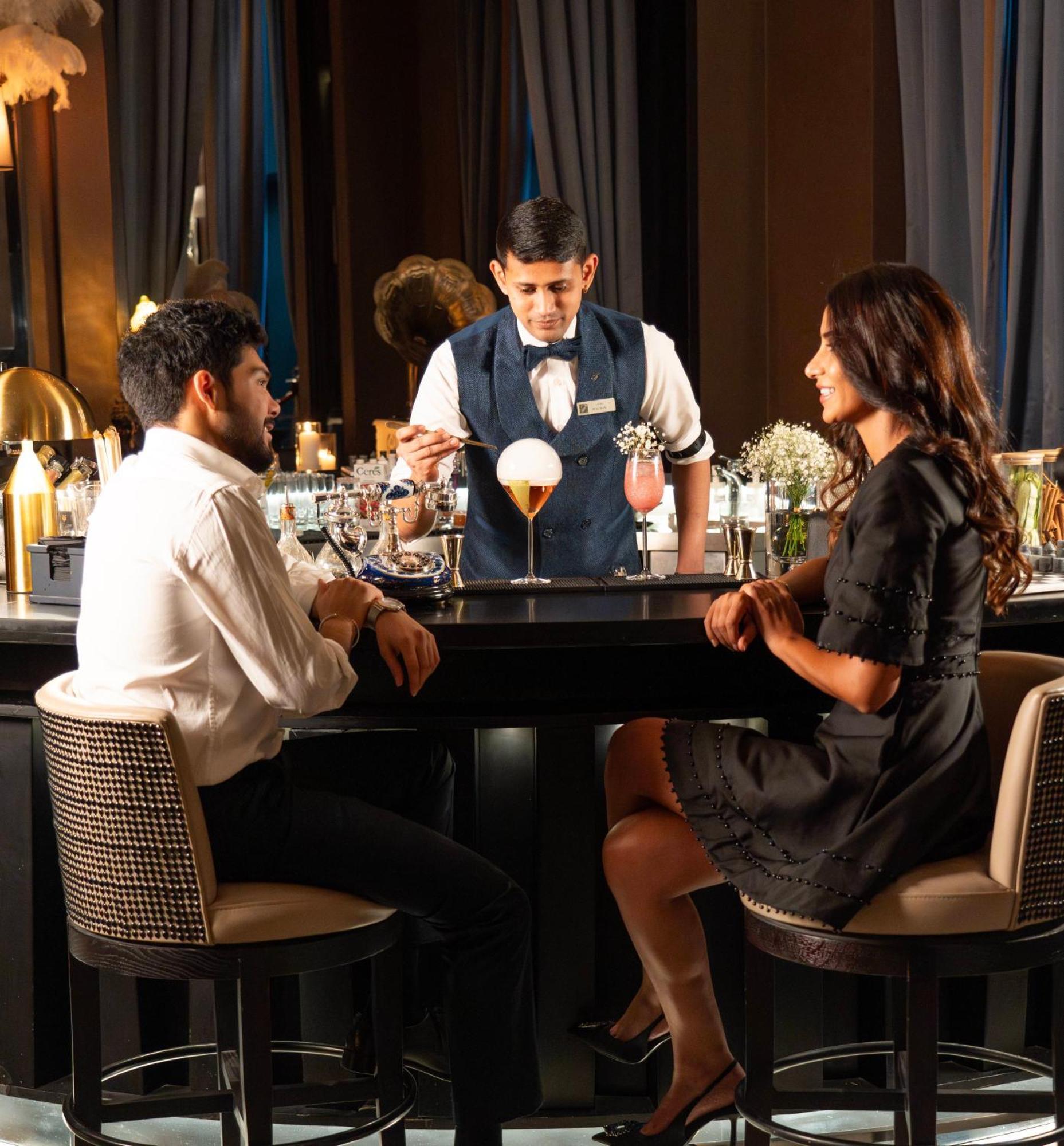 Fairmont Riyadh Exterior photo A bartender serving drinks