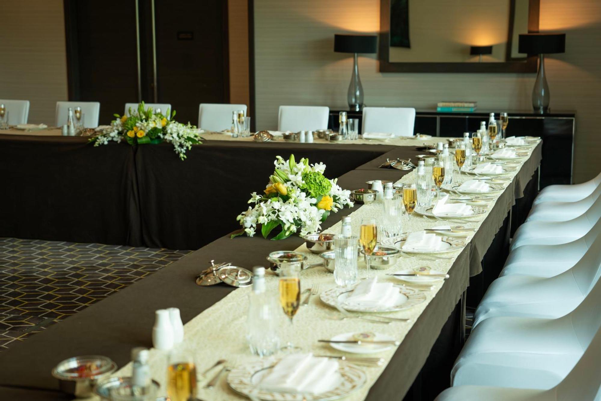 Fairmont Riyadh Exterior photo A table set for a formal dinner